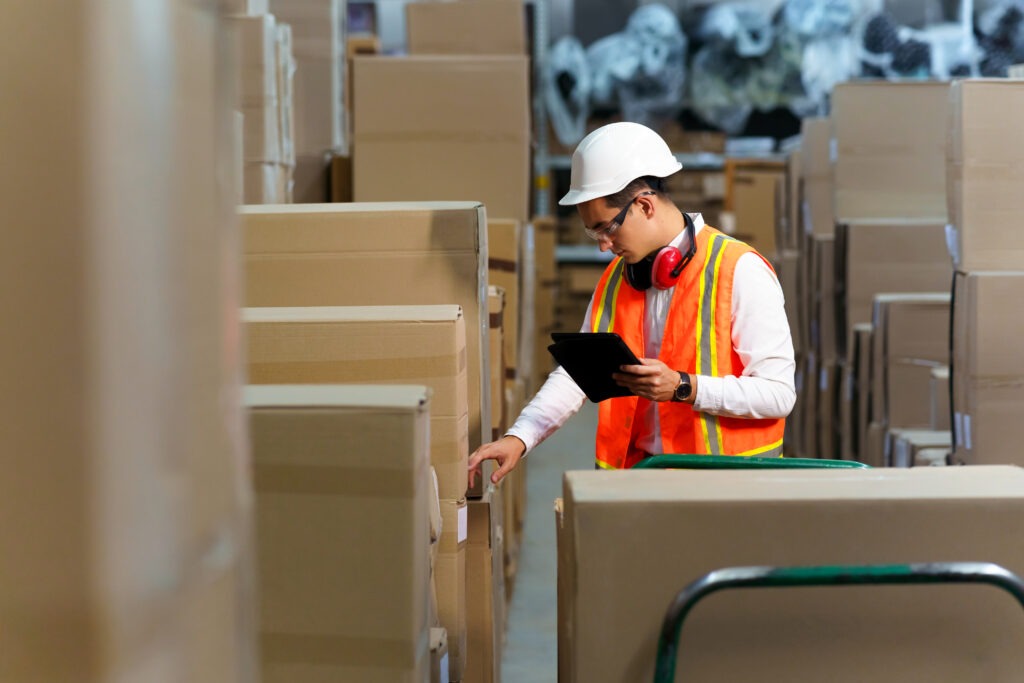 Employee of a logistics warehouse conducts an inventory