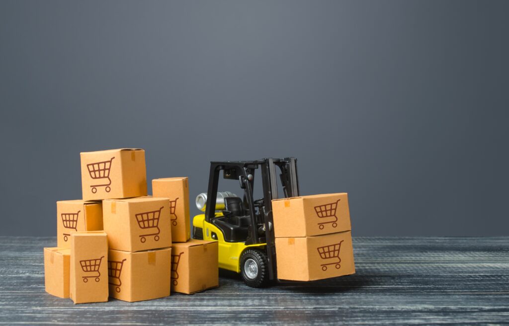 Yellow Forklift truck and boxes of goods