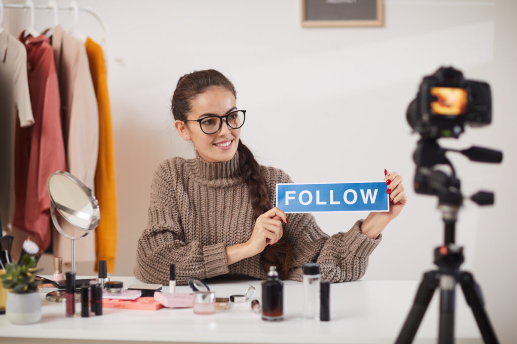 Social Media Influencer with follow sign