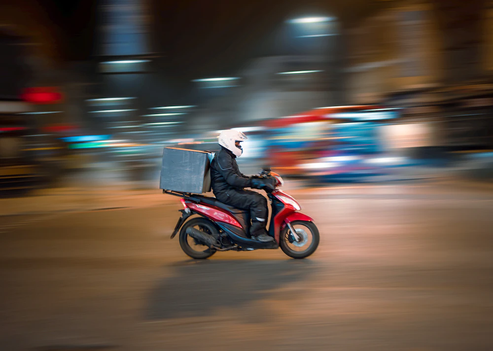 delivery driver on motorcycle