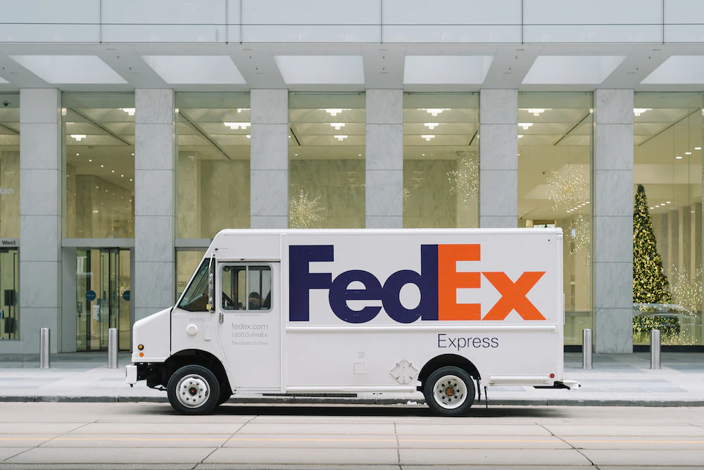 fedex truck parked outside holiday store